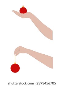 Close up hands holding Christmas ball ornaments isolated on white