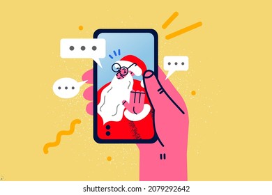 Close up of person hold modern smartphone talk on video call with Santa Claus. Man have webcam virtual digital communication with father Christmas. New Year celebration miracle. Vector illustration. 