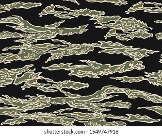 Close range Tigerstripe (French Lizard) camouflage seamless pattern. Green, brown, khaki on black background.