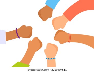 Close up top view of a team of children with different skin colors putting their fists together. Stack of hands. The concept of unity and teamwork.