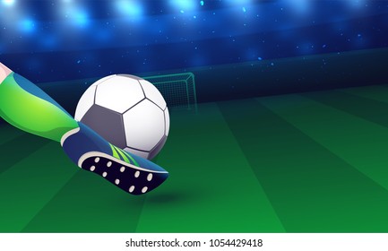 Close view of a footballer leg while kicking a soccer ball in goal post.