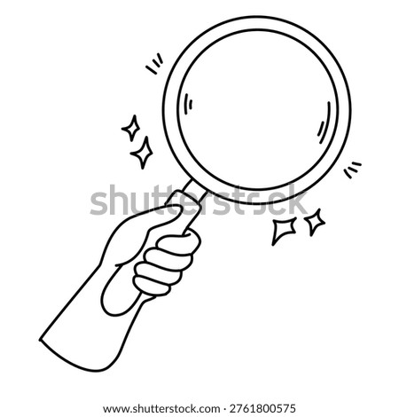 Close up view of hand grasping glass lens for exploration and discovery