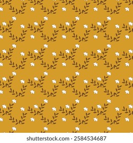 A close up of a yellow background with white flowers and leaves 