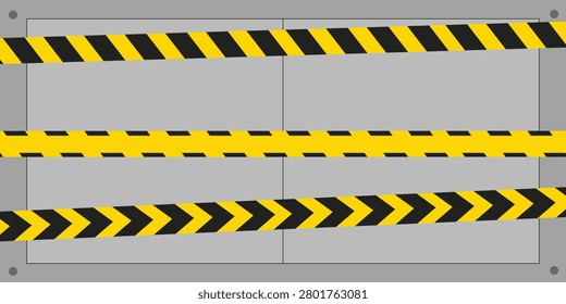 Close up of yellow and black hazard tape strips forming a barrier pattern