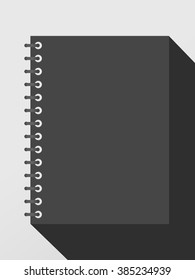 Closed black notepad notebook with spiral and long shadow on gray background