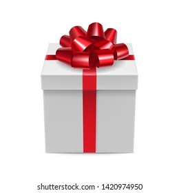 Closed cardboard square box with glossy red ribbon bow mockup. Happy new year and xmas gift packaging with silk tape decoration. Realistic white 3d pasteboard container isolated vector illustration.