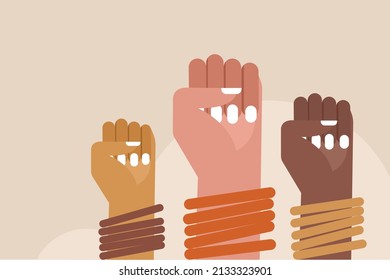 Closed fists of women wearing bangles. Concept for Women's day