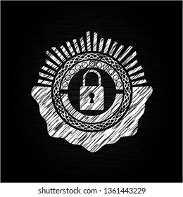 closed lock icon inside chalkboard emblem on black board