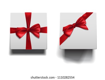Closed low and high boxes with shadows set isolated on white background. White square boxes with red ribbons and bows template.