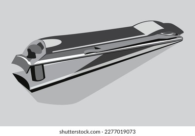 Clipper de clavos metálico cerrado aislado en fondo gris