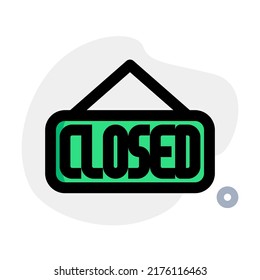 Closed sign board hanging at shopping mall door