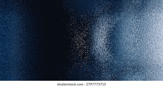 Close-up of an abstract blue textured surface showing light reflections and grainy details