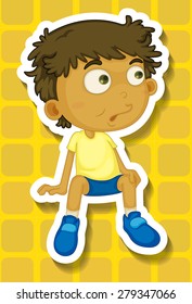 Closeup boy sitting on yellow background