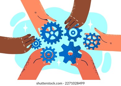 Close-up of hands of company employees with variety of gears for concept of teamwork and collaboration. Colleagues work together on company development strategy consolidating efforts during teamwork