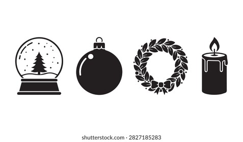 Close-up of holiday-themed objects including a snow globe, ornament, wreath, and candle, perfect for Christmas and winter celebration imagery.