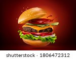 Closeup of homemade hamburger with splashing ketchup, isolated on red black background, 3d illustration