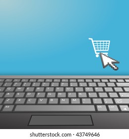 A closeup of a laptop computer keyboard with shopping cart internet icon and your copy space on the monitor.