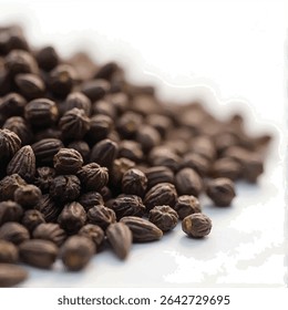 A close-up shot reveals a pile of dark brown, oblong seeds, possibly from a plant like nutmeg or black pepper, artfully arranged on a bright white background, with the seeds