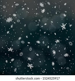 Closeup snowfall on dark night black backdrop. Winter holiday Christmas background. Big and small snowflakes falling from clouds