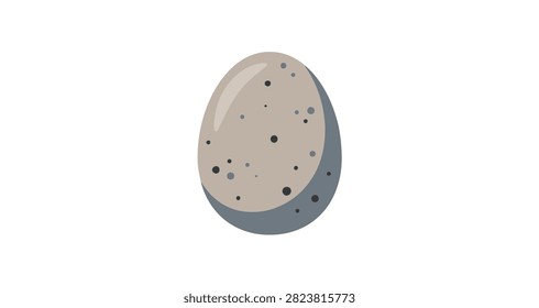 closeup of speckled egg with grey base color and scattered black spots showing natural oval shape and texture