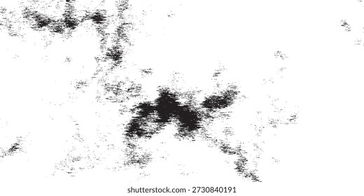 Uma visão em close-up de manchas abstratas de tinta escura criando um padrão texturizado em uma superfície branca.