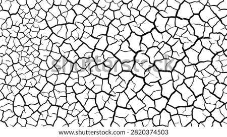 Close-up view of cracked dry earth texture, symbolizing drought and arid conditions.