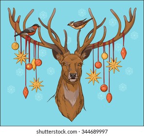 close-up view of deer head with horns, birds and christmas decorations