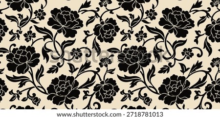 A close-up view of a floral pattern featuring black flowers on a beige background