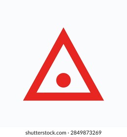 Close-up of a warning triangle sign featuring a red border and a central red dot, used for safety and caution indicators.