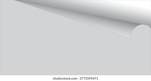 A close-up of a white paper corner curled upwards, revealing a subtle shadow and texture. The background is a plain, light gray.