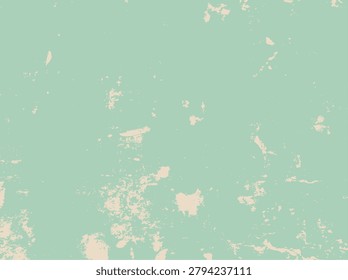 Close-up of a worn, peeling mint green paint surface with beige spots