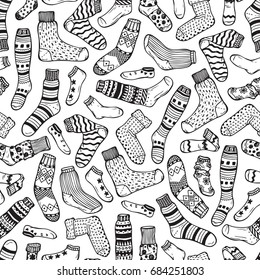 Clothes background. Socks Vector Seamless pattern. Hand drawn doodle socks and stockings. Black and white illustration