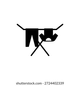 Clothes drying rack icon. Stand for dryer clothes. Portable folding clothes drying rack with a shirt and pants hanging to dry. Isolated vector illustration on white background.