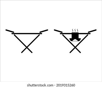 Clothes drying rack. Stand for dryer clothes. Isolated vector illustration on empty background. Black silhouette.