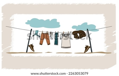 clothes are drying in the wind, there are shoes nearby