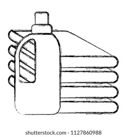clothes folded with detergent bottle
