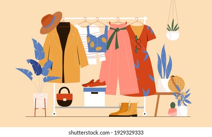 Clothes hanger, garment rack, showroom and clothing organization concept. Clothes, hangers, shoes, bags.