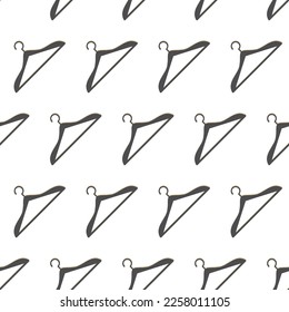 Clothes hangers on a pattern. Diagonal laconic minimalistic pattern with empty hangers