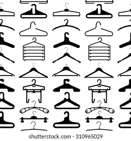 Clothes hangers seamless pattern silhouette. White background.