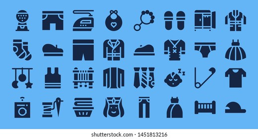 clothes icon set. 32 filled clothes icons. on blue background style Collection Of - Machine, Socks, Crib toy, Washing machine, Shorts, Beret, Sleeveless, Thread, Iron, Sewing machine