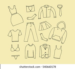 Clothes icon vector on beige background.Hand drawn doodle set with man and woman clothes.