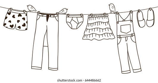 Clothes on washing line isolated on white background 