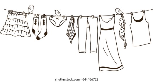 Clothes on washing line isolated on white background 