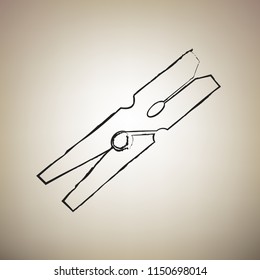 Clothes peg sign. Vector. Brush drawed black icon at light brown background.