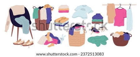 Clothes in piles and stacks. Laundry baskets with t-shirts, panties and blouses. Cartoon casual wear. Domestic preparation for washing. Jeans and coats in wardrobe