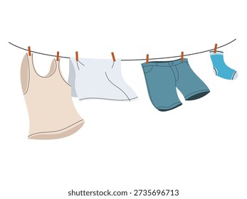 Clothes, socks, towel and jeans drying in the sun