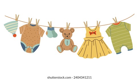 Children’s clothes and toy dry on a rope.  Hat, teddy bear, sliders, bodysuit, dress and other. Vector cartoon.