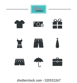 Clothing, accessories icons. T-shirt, business case signs. Umbrella and gift box symbols. Black flat icons. Classic design. Vector