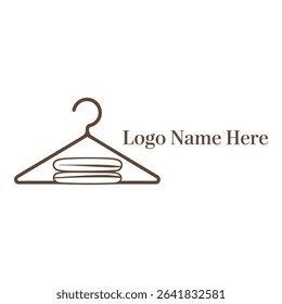 Clothing hanger with folded clothes and logo isolated on white
