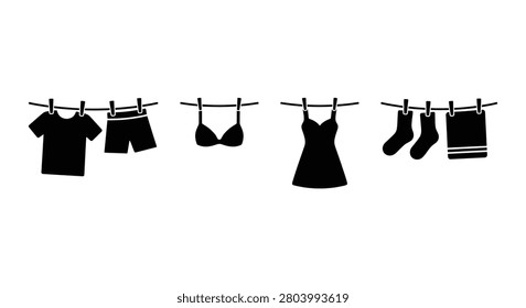 Clothing items hanging on a line depicted as a black silhouette apparel attire bathing suit beachwear briefs clothesline